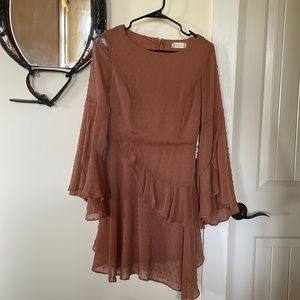 Altar’d State Fun flowy dress never worn. I’d say color is light rust color.